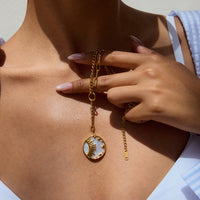 Shine Bright Pendant – Celestial Gold Disc Necklace with Sun & Star Motif