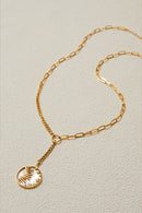 Shine Bright Pendant – Celestial Gold Disc Necklace with Sun & Star Motif